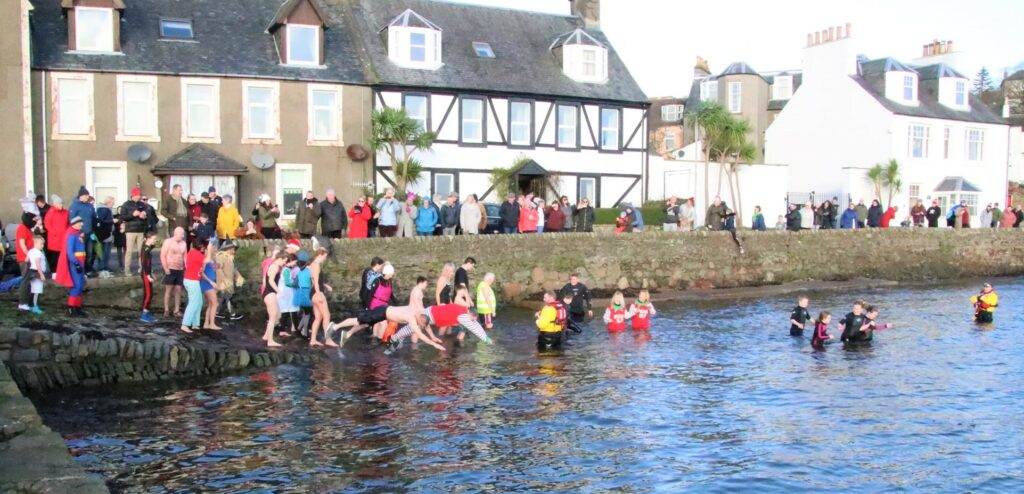 Spectators lined the street and safety personnel were on standby in the water as the first dippers entered the loch.