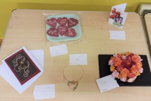 Hand-crafted Valentine's items included cards, baking, jewellery and a floral arrangement.