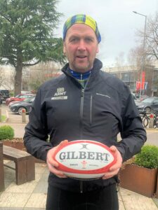 Cycling enthusiast Robbie Semple with the match ball that was taken from Edinburgh to Cardiff.