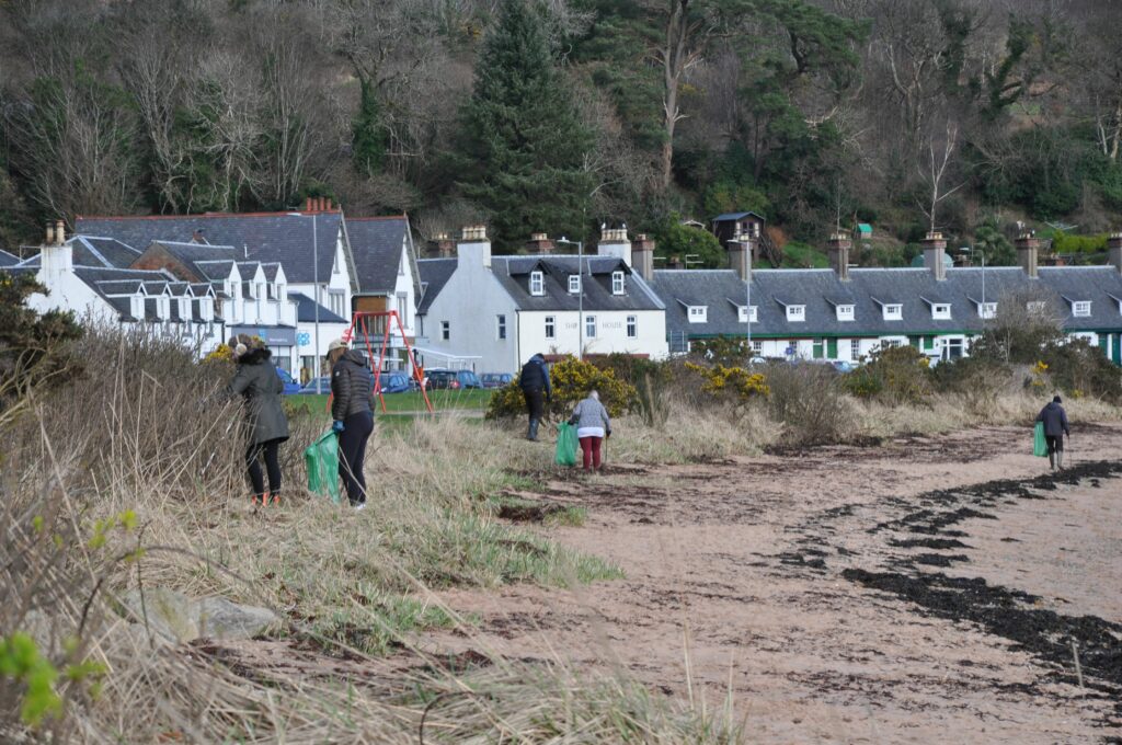 Volunteers scour the grass areas where litter accumulates and sea plastic becomes entangled.