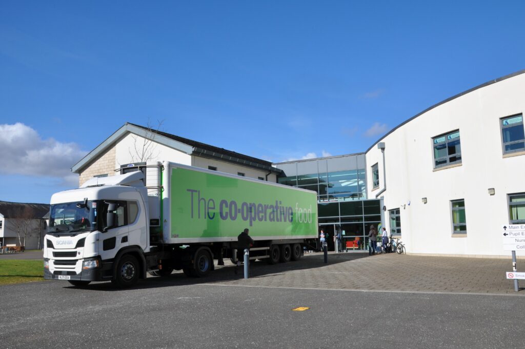 A Co-op lorry delivered donations and was refilled with packaged items destined for the mainland.
