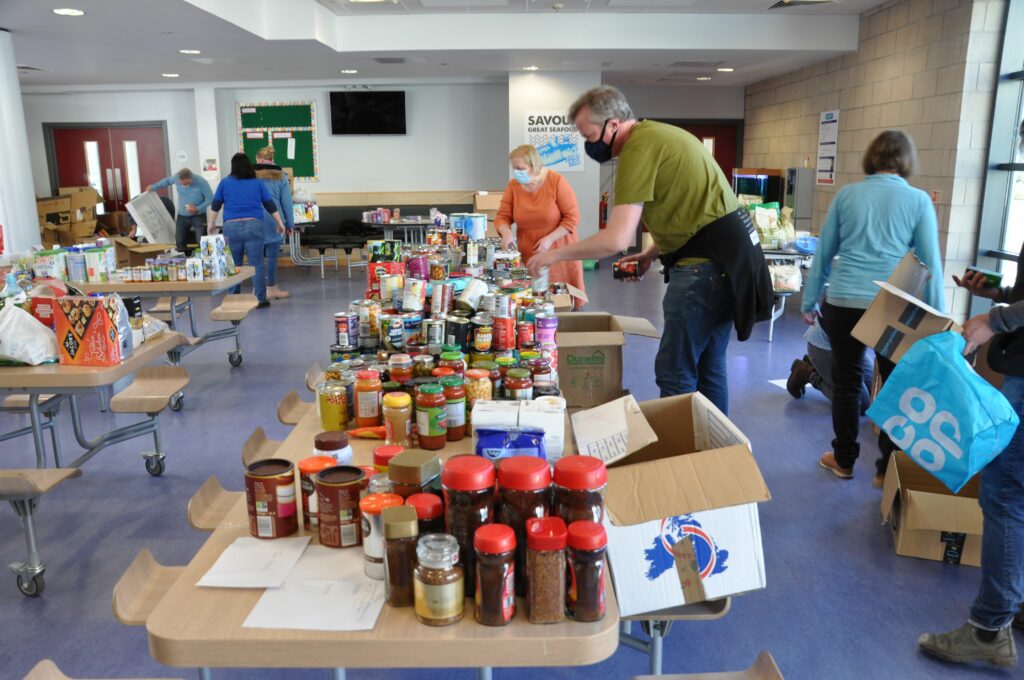 Volunteers sort through the donations and place them into categories.