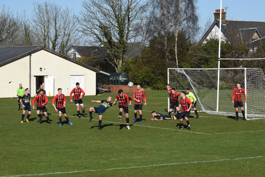 Arran successfully defend against an attack on their goal.