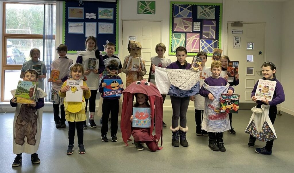 Kilmory Primary pupils show off their costumes and favourite books.