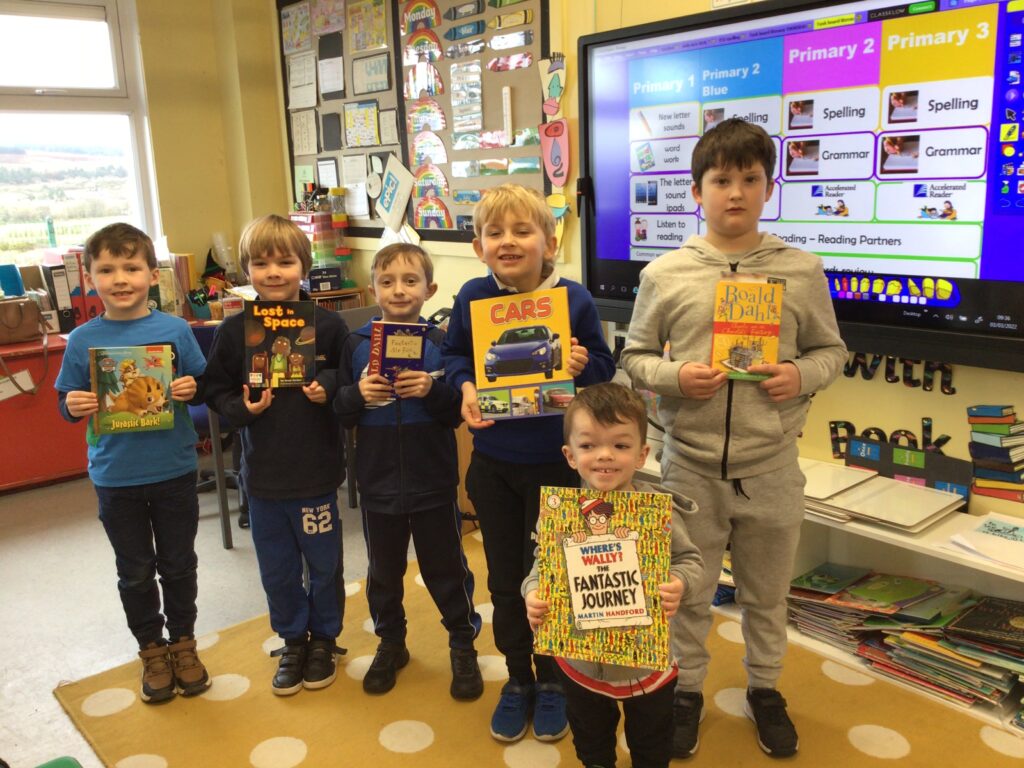 Shiskine Primary boys show off their favourite books.