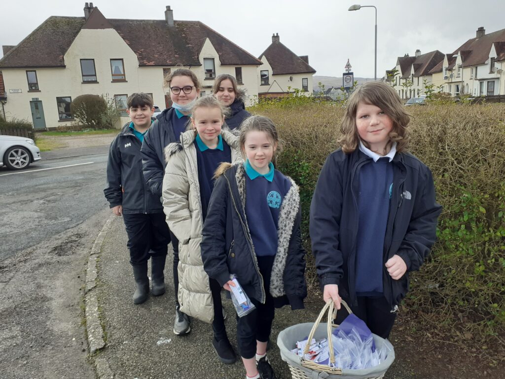 Pupils deliver Fairtrade treats on their 'Random Act of Kindness Walk'. NO_F11_StColumba's_Fairtrade2