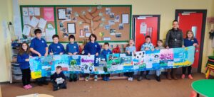 Gigha Primary School's pupils and class teacher Alex Vipurs with their Gigha frieze.