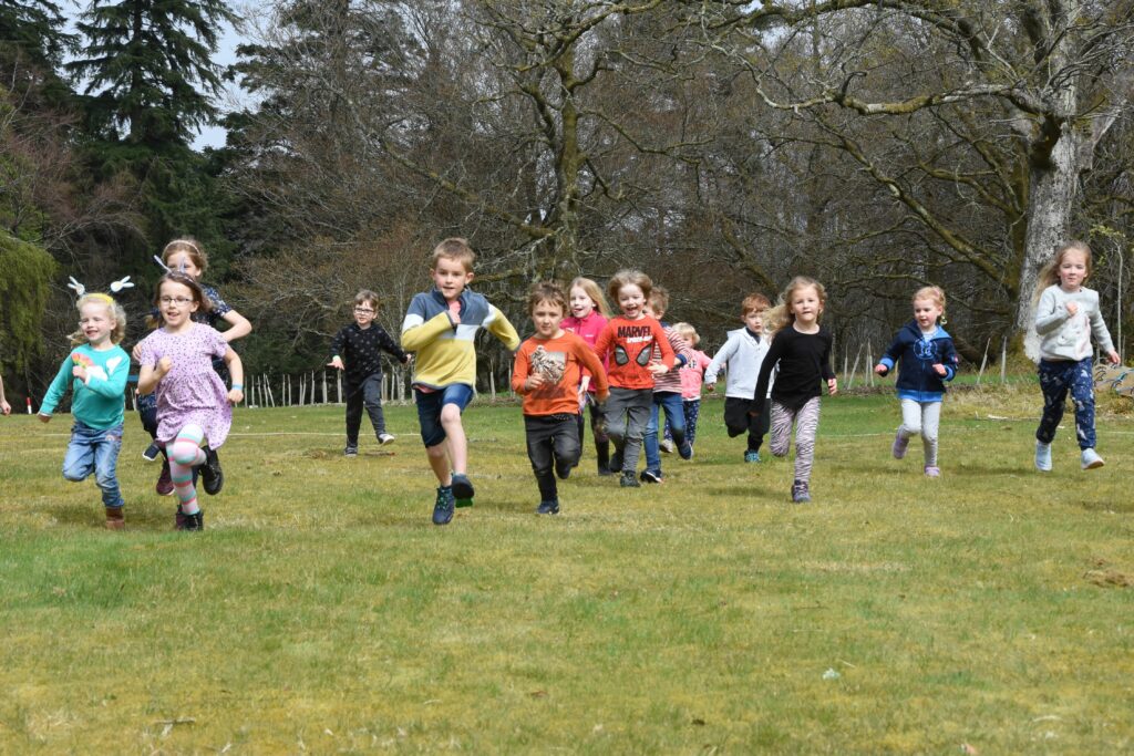 Smiles abound as the children set off in the under six race category.