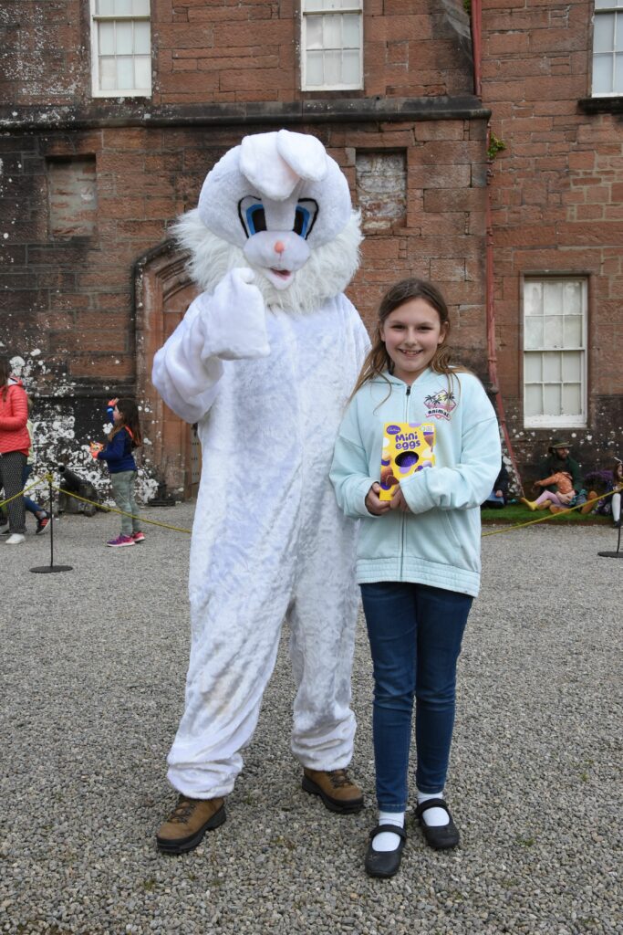 Receiving a prize from the Easter bunny for her egg decorating skills was 11-year-old Isabelle Fenn.