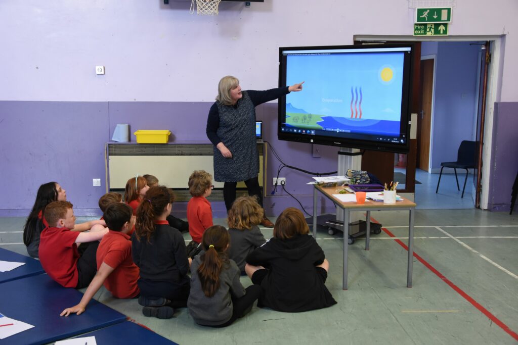 Ms Gardiner teaches pupils about the water cycle using animated video clips.