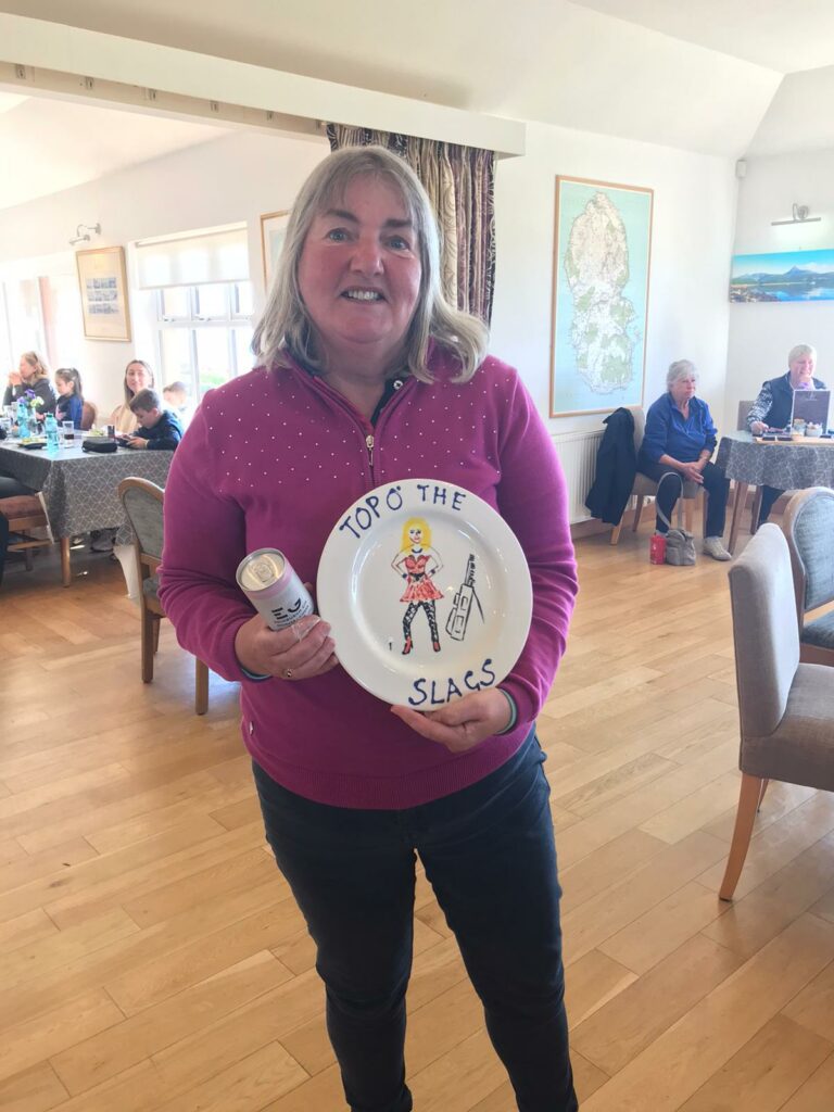Isobel Macdonald with the winner's plate for the Shiskine Ladies Away Golfing Society Tour.