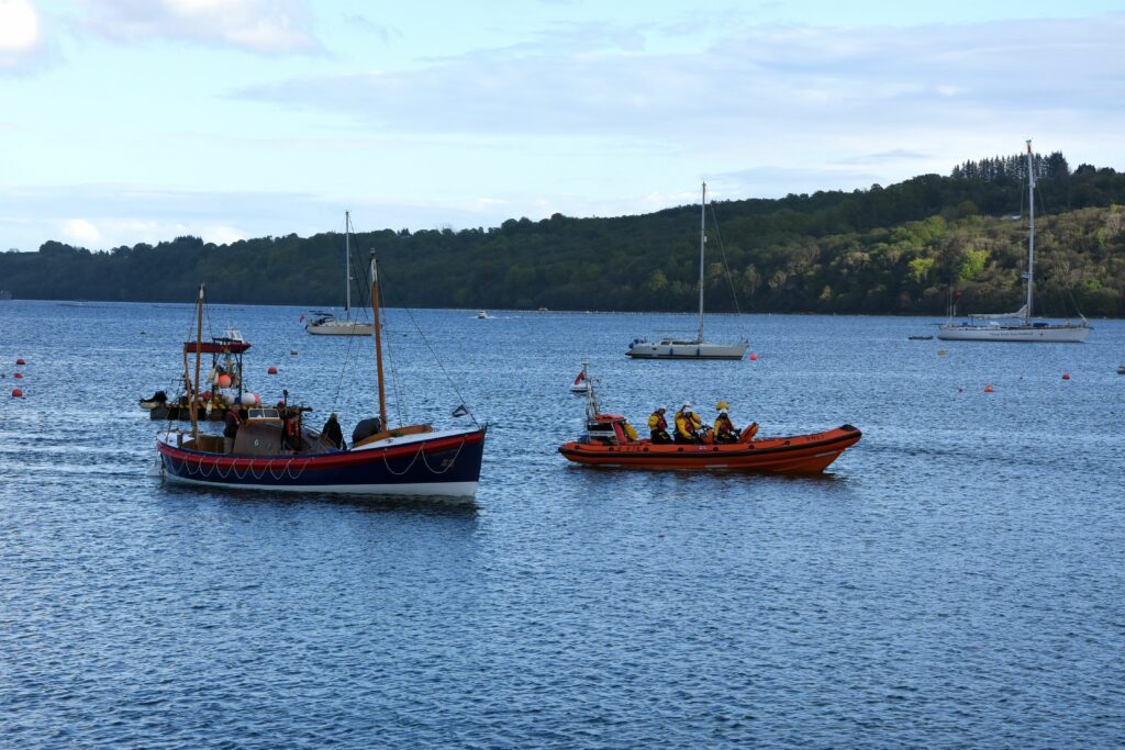 The RNLI accompany the Herbert John as it makes its way around Lamlash Bay.