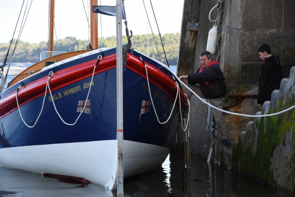 Owner Alastair Bilsland boards the vessel for its first launch from Lamlash pier.