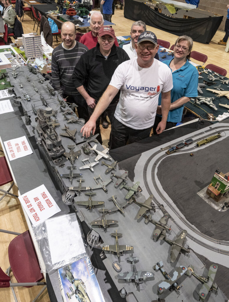 The  Lochaber team of modellers with the large scale Ark Royal covered in aircraft which traces the history of naval aviation. Photograph: Iain Ferguson, alba.photos

NO F18 Model show 02