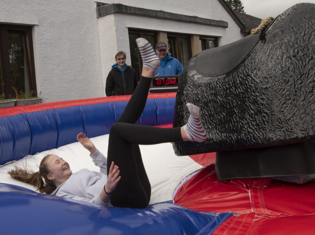 A soft landing and a big laugh after being thrown by the mechanical bull.  Photograph: Iain Ferguson, alba.photos

NO F22 Spean Fun night 01