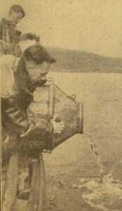 Mr BP Johnson, the area manager, is seen putting the young fish into the water at Glen Lussa; immediately beside him is Mr Archie Roberts, the honorary secretary of the Kintyre Angling Club, and an enthusiastic spectator is Mr Johnston’s schoolboy son Peter.