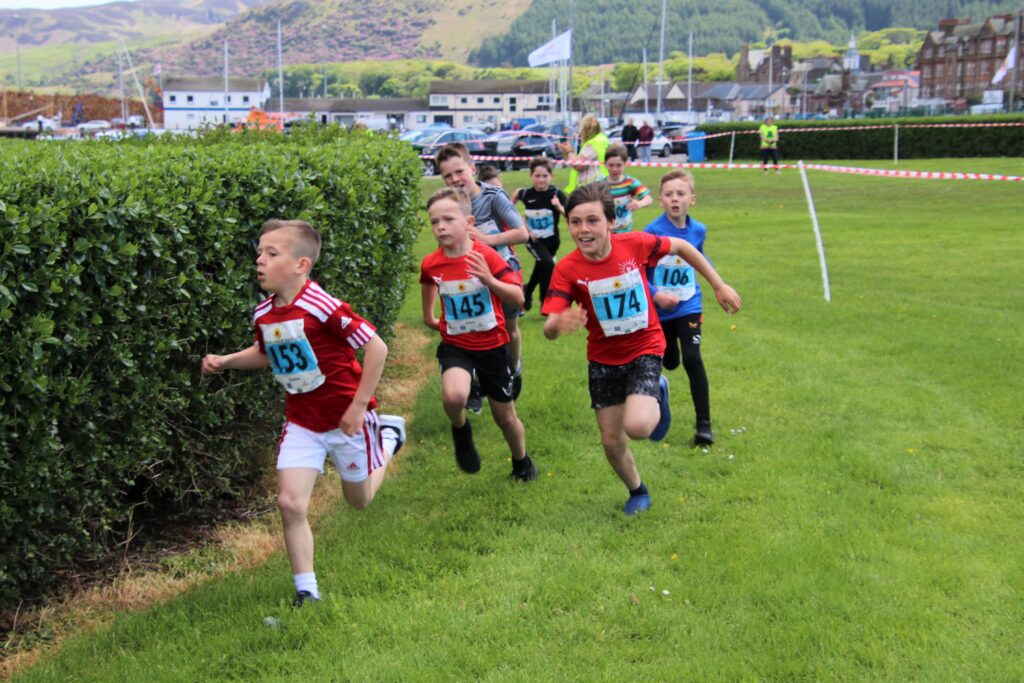 Youngsters make their way round the course in one of the junior races. Photograph: Kenny Craig.