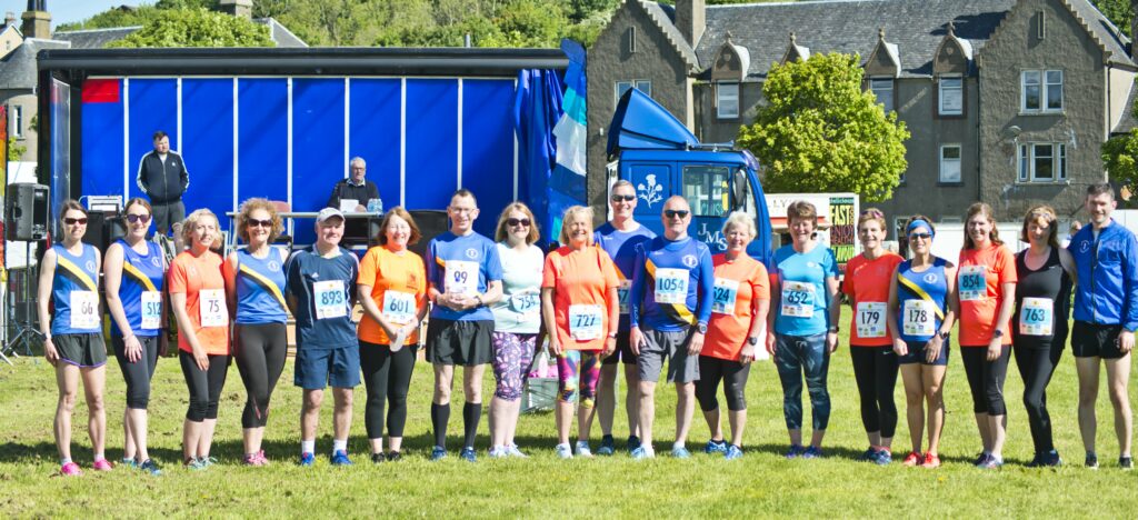 MOKRun's ever presents who have run all 17 races so far. Missing from the photograph are Caroline Armour, Jamie Reid, Valerie Nimmo and Angus Nimmo, who also ran again this year. Photograph: John McFadyen.