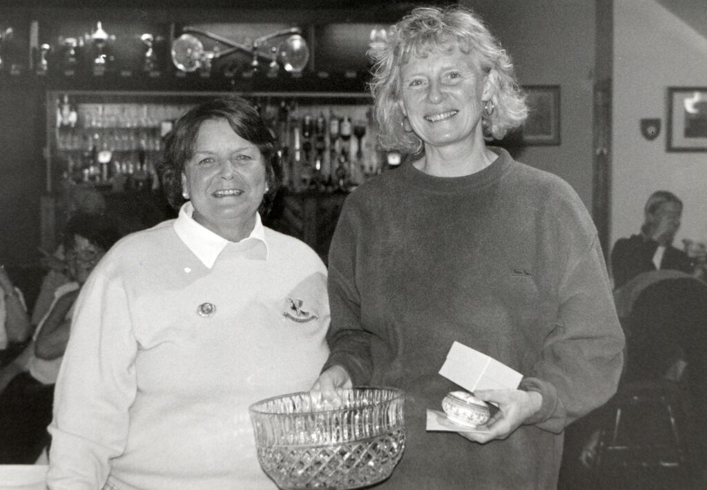 Lamlash Golf Club lady captain Liz Paul presents the Josie Sanderson crystal bowl to Jenny Pattenden of Corrie.