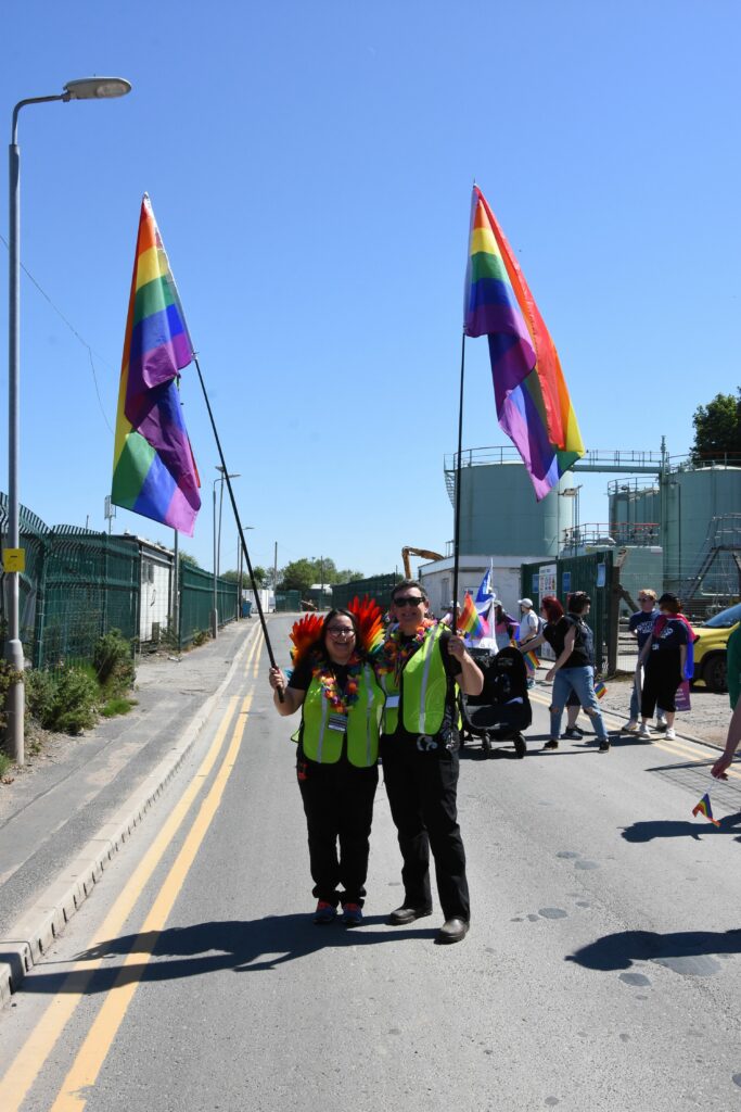 Arran Pride committee members, Sofia Pantazidou and Alix Hitching, with their Pride flags.