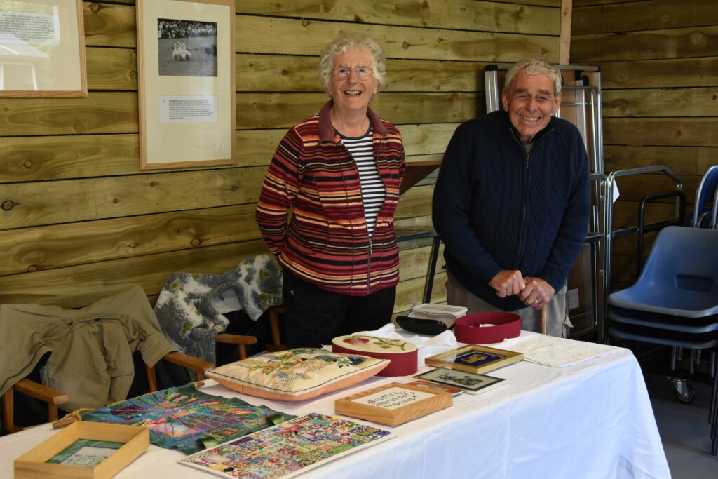 Elizabeth and Marshall Ross show off some of the embroidery done by the Arran Embroidery Group.