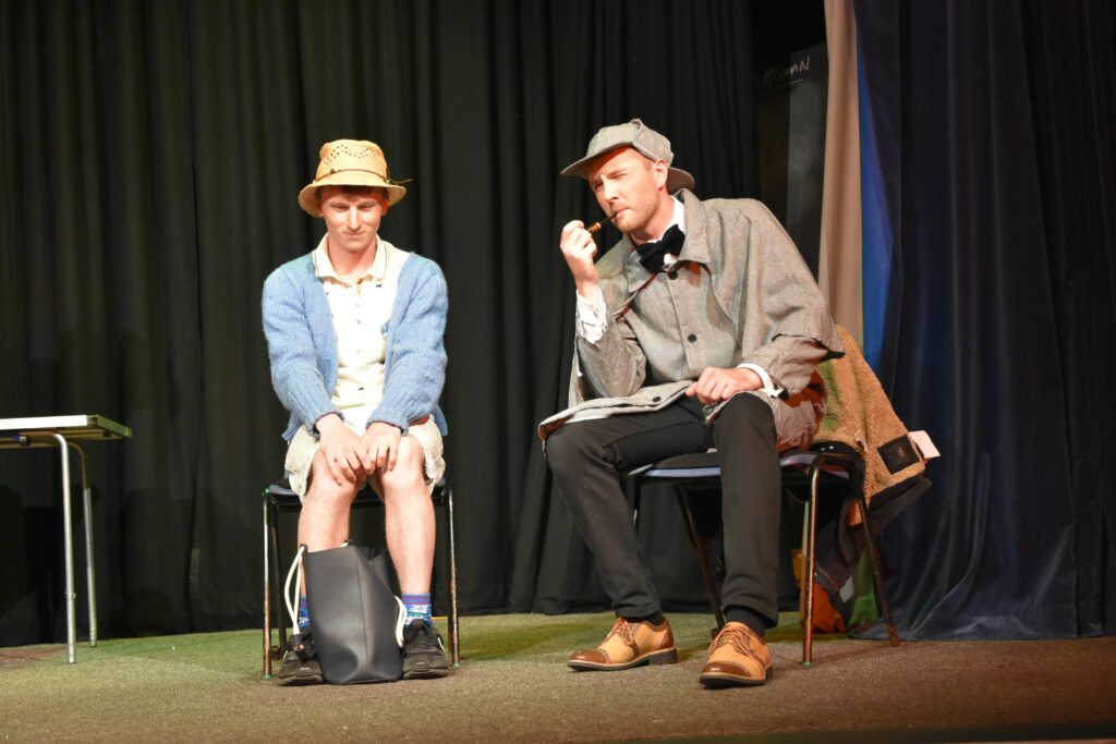 Anne Barnard (Rhodri Herapath) and Sherlock Holmes (James Mutch) take a moment to contemplate a mystery in Sleuth School.