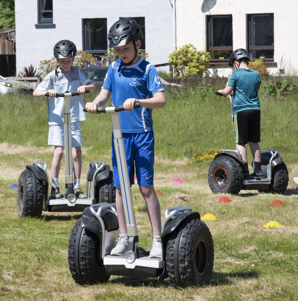 Free shots of the Segway were very popular throughout the day. Photograph: Iain Ferguson, alba.photos

NO F23 Caol Community party 03