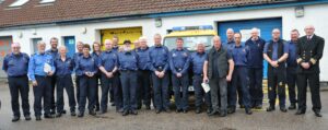 Long service medal and Platinum Jubilee Medal recipients at Mallaig on Monday evening. Photograph: Mark Entwistle. NO F24 Coastguard line-up