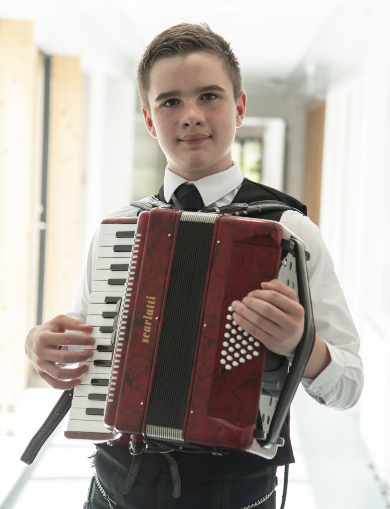 The multi-talented Alasdair Iain MacAoidh of Ardnamurchan High School who , over two days,  took top places in the accordion, poetry, conversation, solo singing and piping competitions. Photograph: Iain Ferguson, alba.photos

NO F26 Mod Alasadair Iain