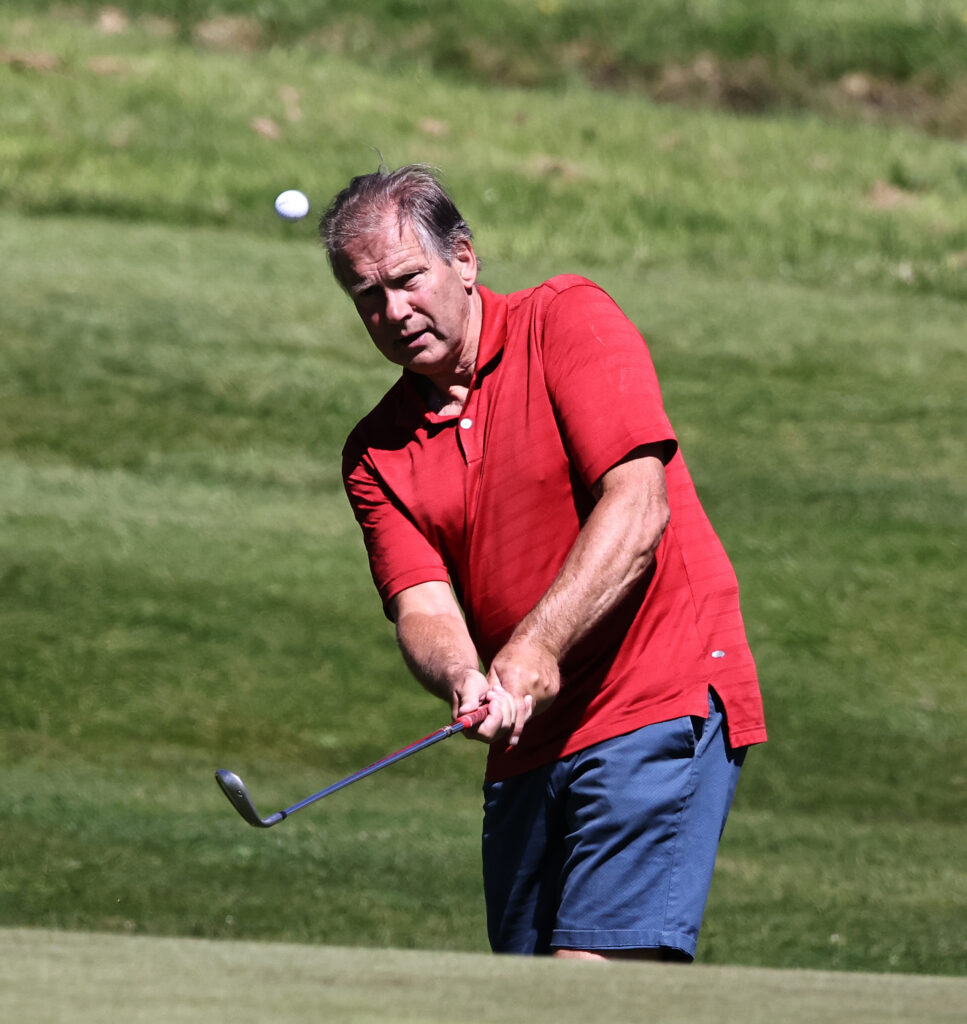 Nigel Evans concentrating on his play for The Oban Times, chips on to the 18th green. The Oban Times team finished in 3rd place. Photograph: Kevin McGlynn.