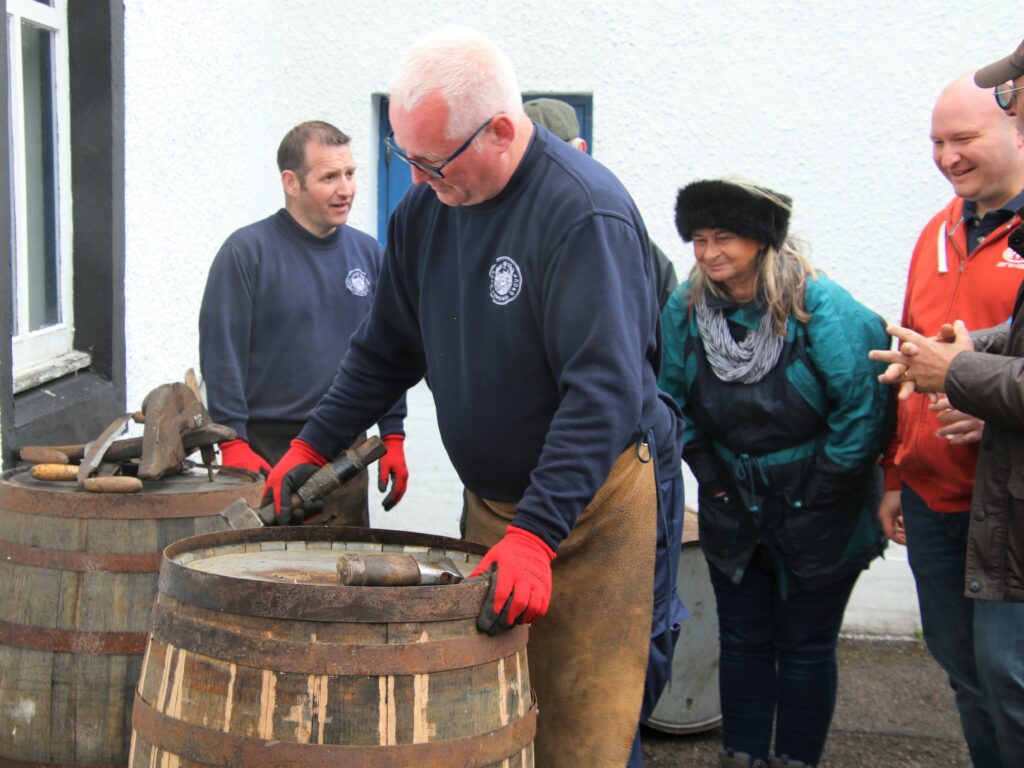 Visitors pay attention during a demonstration at Glen Scotia Distillery. Photograph: Kenny Craig.