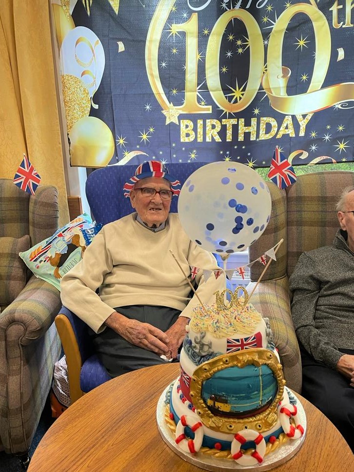 Former merchant seafarer Bob Miller celebrated his centenary with a nautical-themed birthday cake.