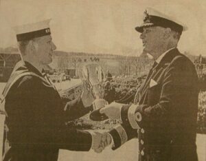 In 1997: Marine Engineering Mechanic Lee Nightingale received his trophy from Commodore Hugh Rickard, the Commanding Officer of HMS Raleigh who took the salute at Lee’s passing out parade.