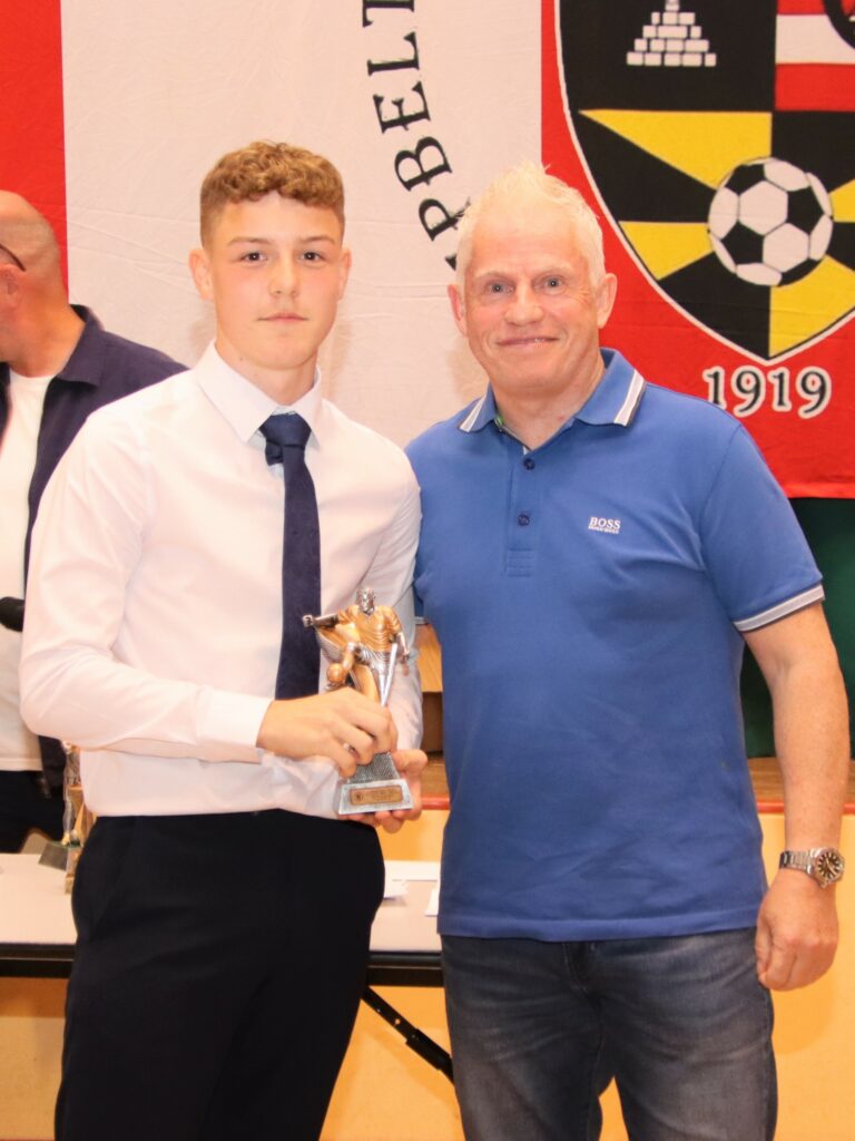 Calum Ellis receiving the top goal-scorer of the season award from Ian McGeachy who has been a huge help to the 2005s over the years.