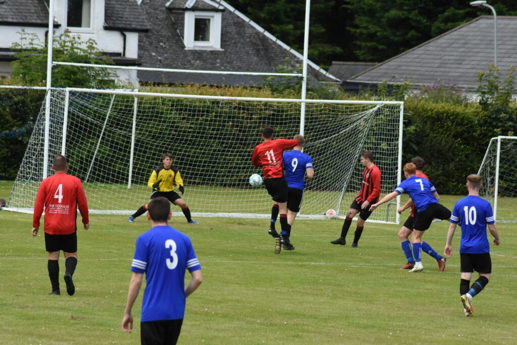 The Arran defence stand firm to a Kirkoswald attack.
