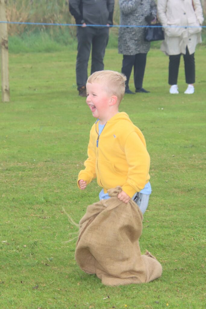 Little William Walker had a great time in the sack race.