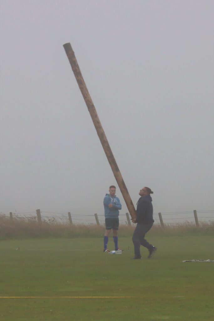 Caber tossing in the mist.