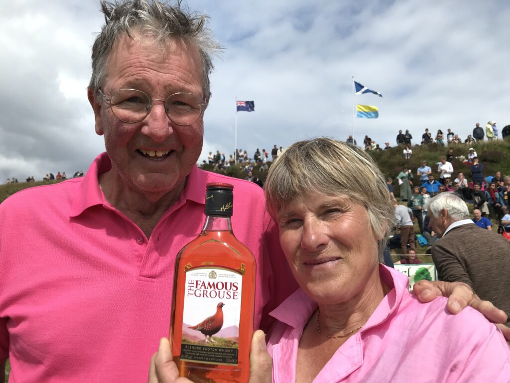 Jude and Theo Mezger take home a whisky prize after entering visitors' races at the Mull Highland Games 2022KG_T30-visitorracewinner