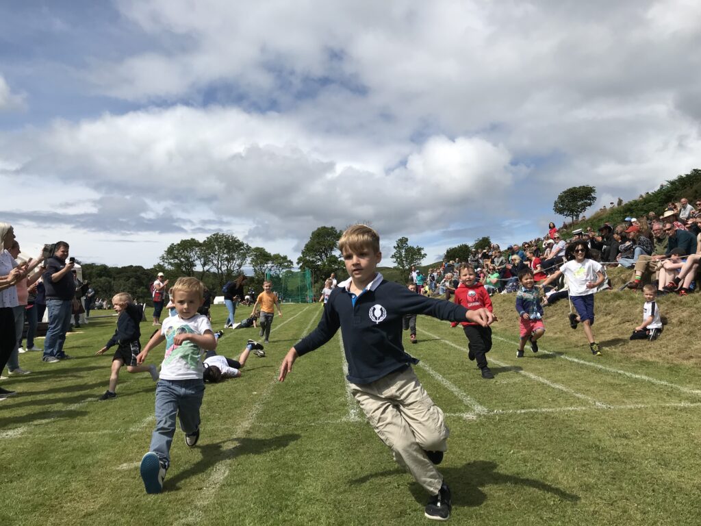 First pastthefinishing post in the boys' race at Mull Highland Games 2022
KG_T30_boysrace