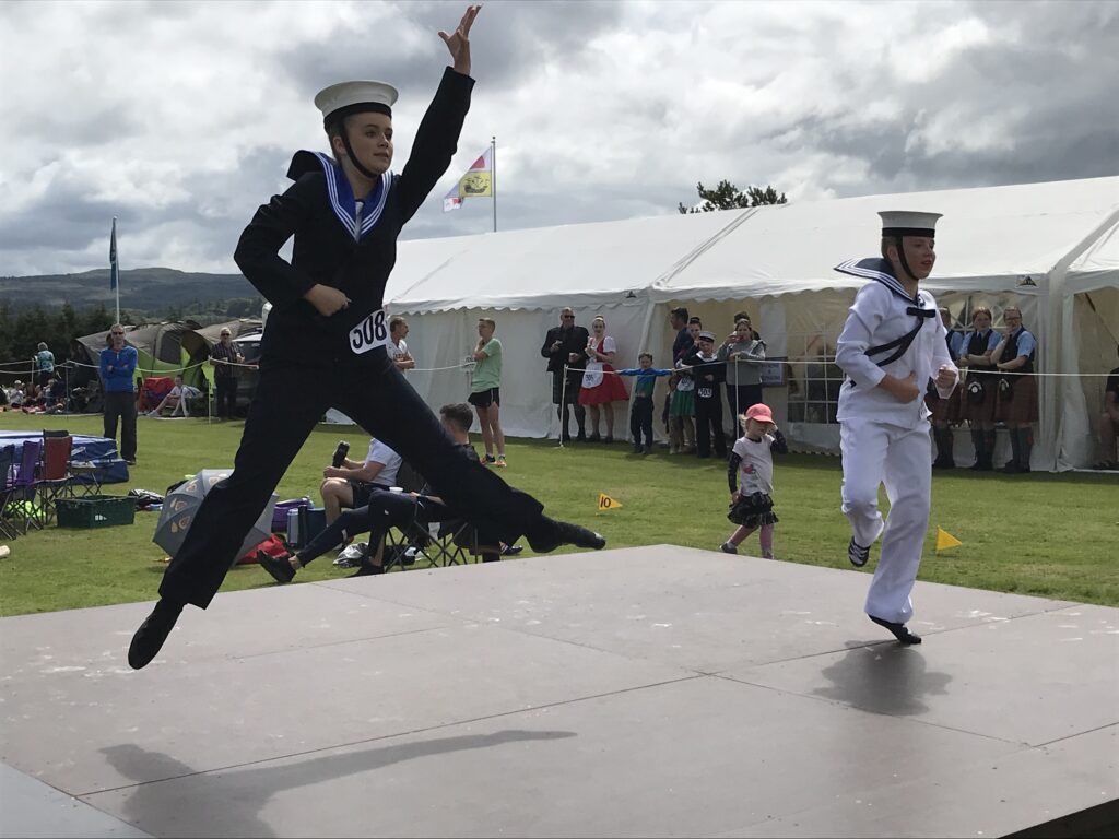 Sailor hornpipe dancing in front of the judges at the 2022 Mull Highland Games
KG_T30_hornpipedancers