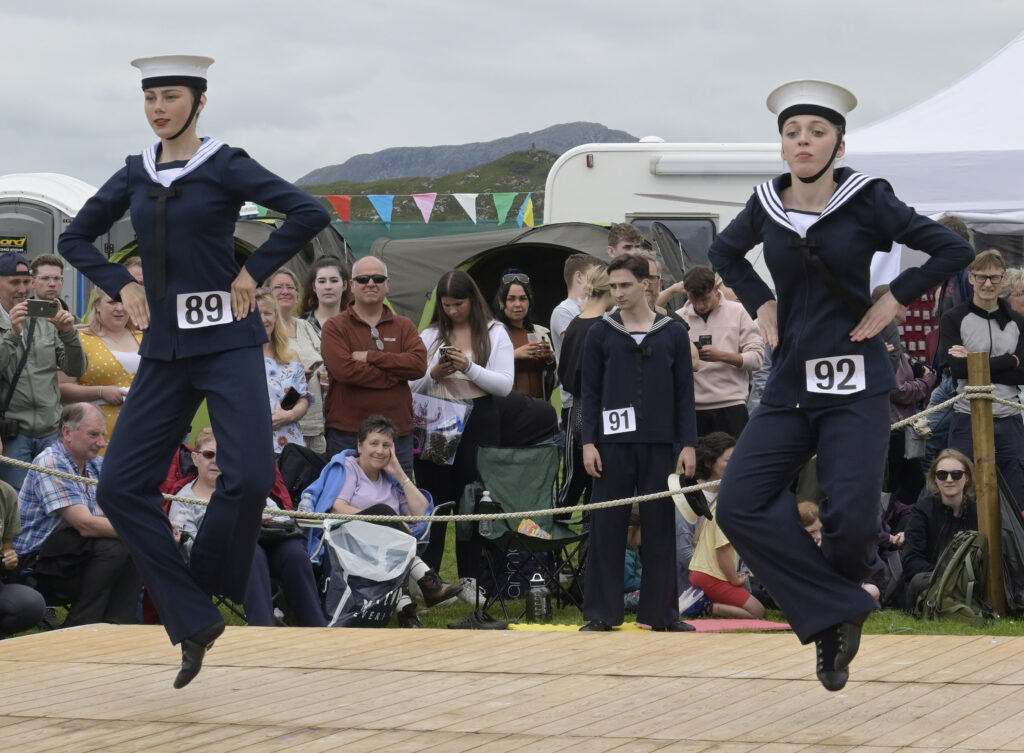 Two young ladies dance the Sailor's Hornpipe in the Highland Dancing competitions. Photograph: Iain Ferguson, alba.photos NO F31 Arisaig Games 07