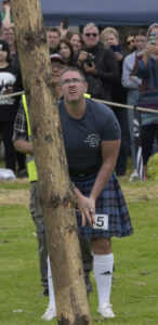  Local athlete David Hart watches as his caber veers disappointingly off track. Photograph: Iain Ferguson, alba.photos NO F31 Arisaig Games 17 David Hart