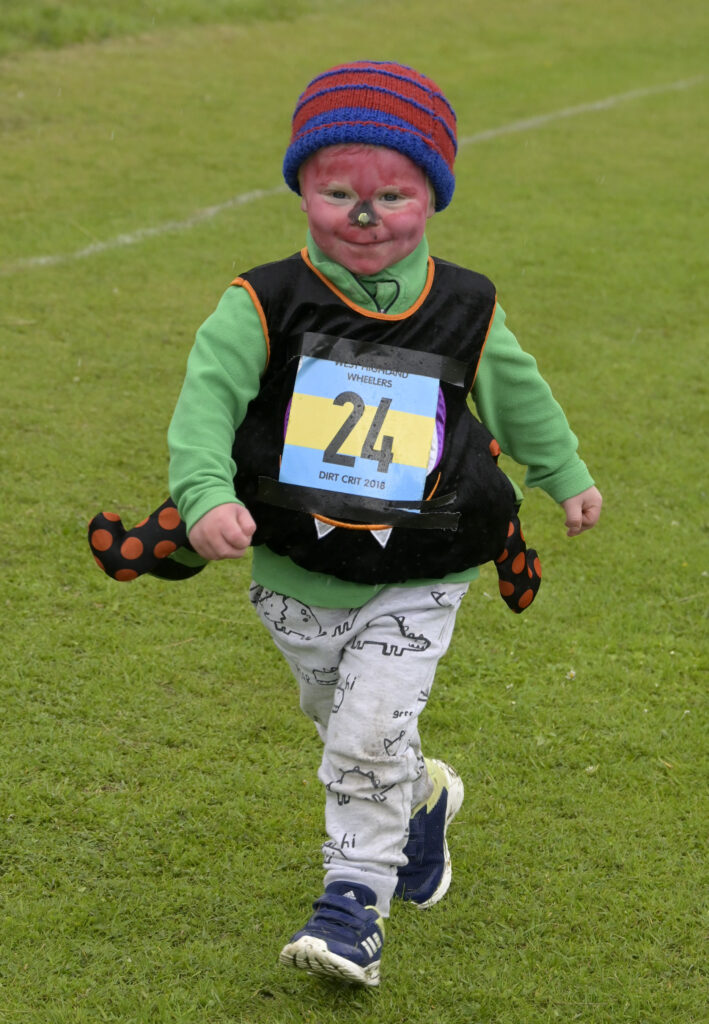 Three-year-old Bo Barnes limbers up for the Five and under race. Photograph: Iain Ferguson, alba.photos.