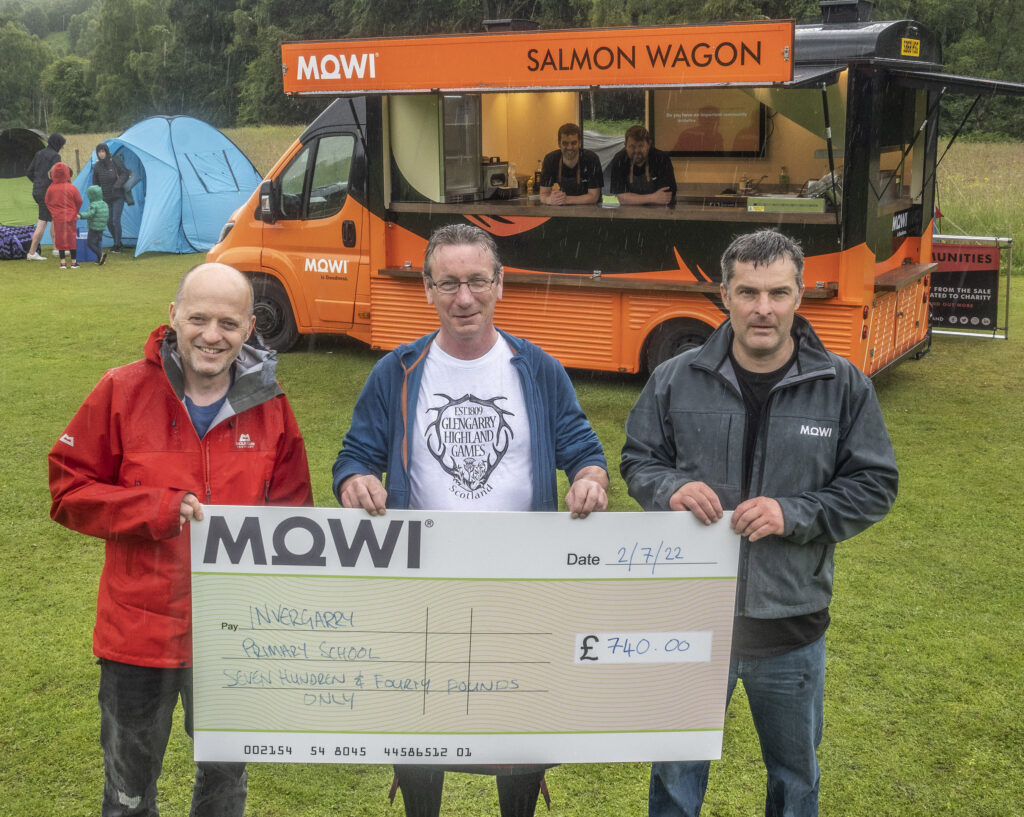 The MOWI Salmon Waggon served up treats throughout the day, raising £740 for Invergarry  Primary School.    Principal  Teacher Tom Parkins (left) was presented with a cheque by MOWI's Julian MacAskill (right) and games committee member, Gregor Donald, with Ross Sharrot and Ken Loades, who cooked and served up the food. Photograph: Iain Ferguson, alba.photos.