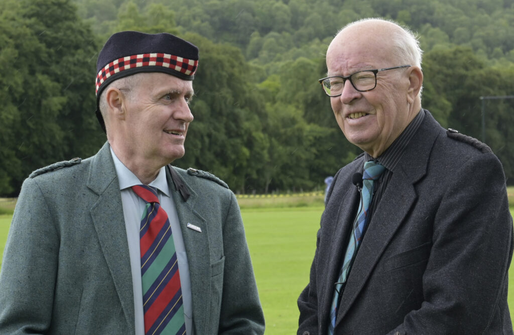 Veterans, Alasdair MacDonald (left) of the Highland Games Association, who oversaw many events and Announcer Eric MacKenzie.  Photograph: Iain Ferguson, alba.photos.