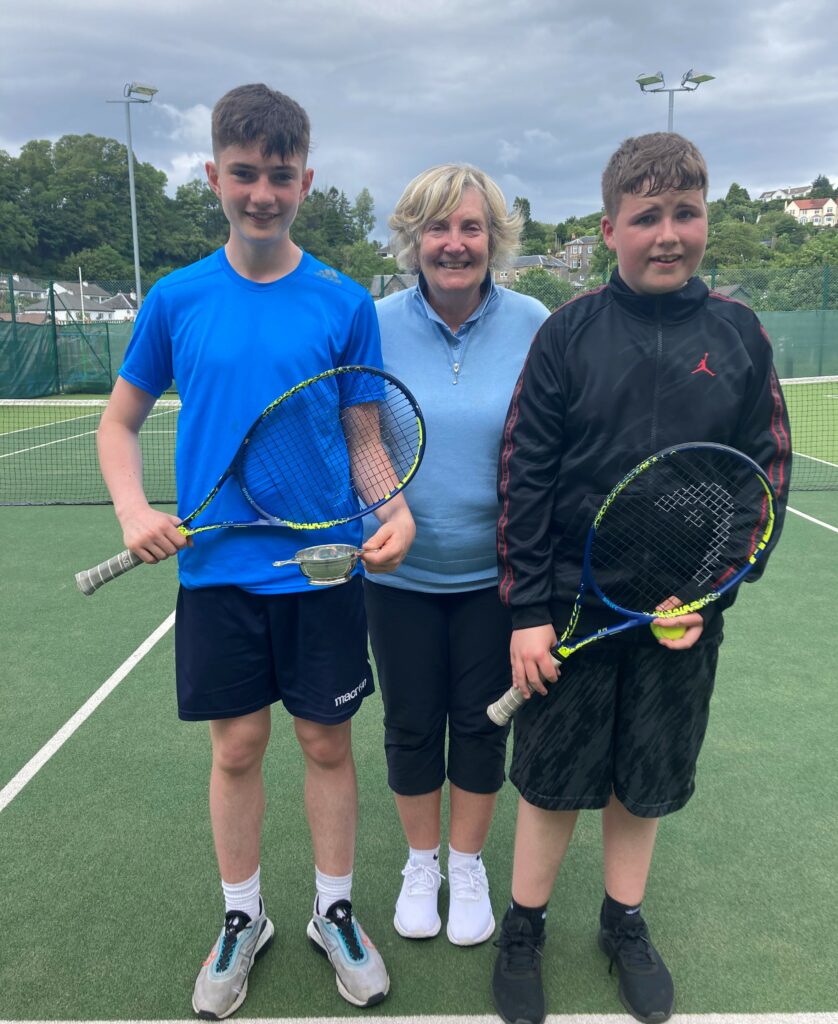 Tournament organiser Mary McLean with Oban High School S1-S3 winner George Pagan and Runner-up David Simpson.