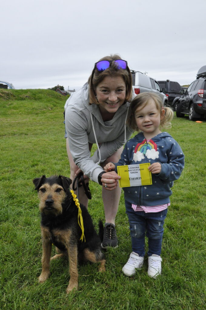 The third happiest dog Gerry with two year old Ruby Houston and Jennifer Campbell from County Antrim.
