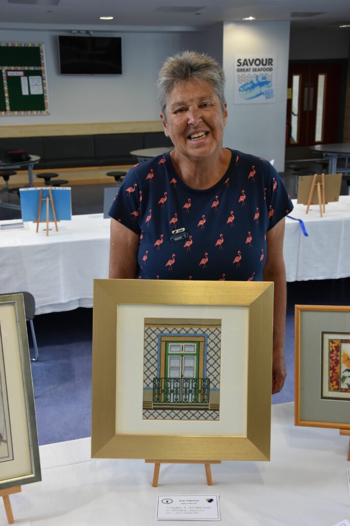 Kildonan institute member Angela Irving with her embroided display of a Portuguese balcony.