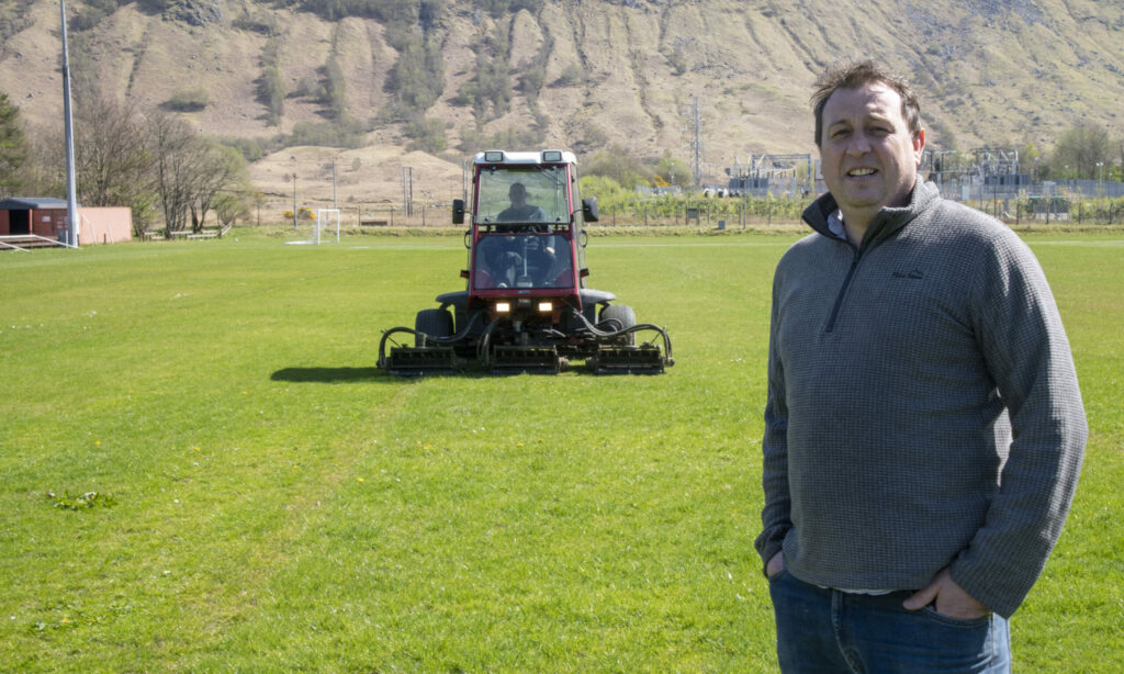 Fort William FC chairman, John Trew, pictured here oveseeing the grass cutting at Claggan Park at the weekend. Photograph: Iain Ferguson alba.photos NO F17 FORT FC GRASS CUTTING 01