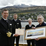 Pam Weller of Nevis Radio presented a picture of Ben Nevis, donated by local businessman Drew Purdon, to Captain Erik Eng, Master of cruise ship MS Maud and his crew on their maiden visit to Fort William. The trip was organised by Sarah Kennedy of Fort William Marine and Shoreline Association. who was also on board to present him with Ben Nevis whisky and wax candles from her own bee hives. Photograph: Iain Ferguson, alba.photos NO F18 MS Maud visit 01